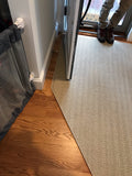 Elegance Carpet shown as a custom fabricated runner in a home front entrance