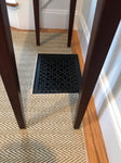 Elegance carpet shown as custom fabricated area rug that has been specifically cut out to leave opening for floor vent