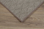 Corner picture of Alec Pewter showing geometric details and narrow cotton binding